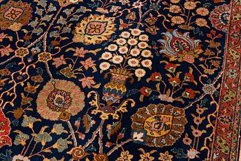 A semi-antique Tabriz carpet, c. 395 x 295 cm.