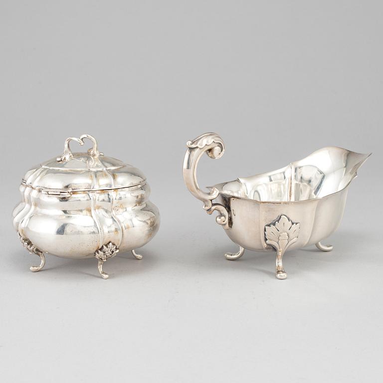 A rococo-style 20th century silver cream-jug and sugar-box, Swedish import marks.