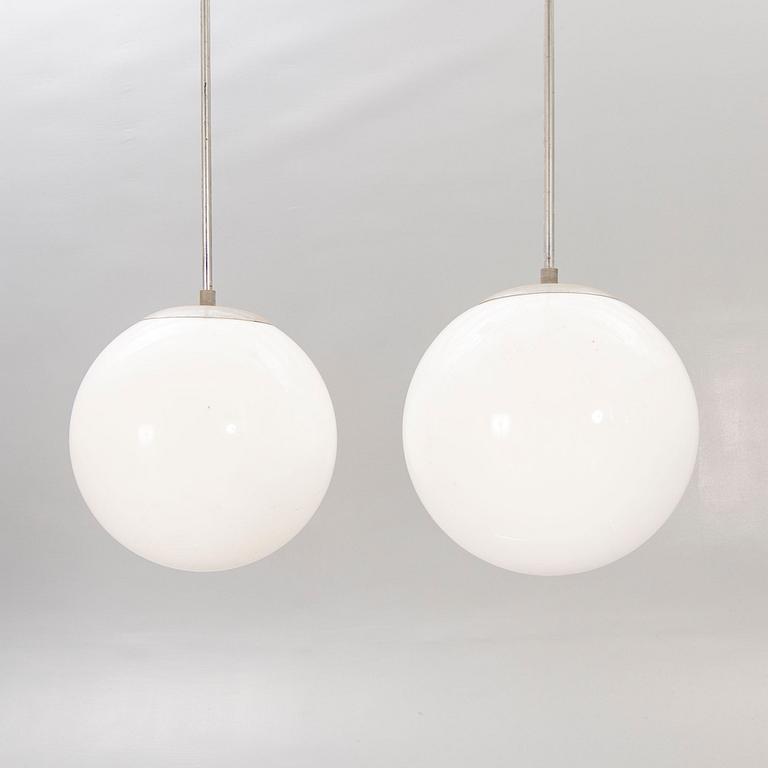 A pair of 1930s glass and chromed ceiling lights.