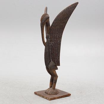 A sculpture, likely Ivory Coast, 20th century.