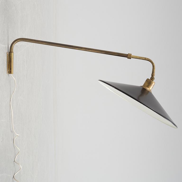 A 20th century brass and painted metal swing-arm wall light.