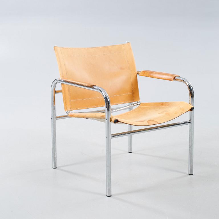 An armchair designed by Tord Björklund, named "Klinte" and made in the fourth quarter of the 20th century.