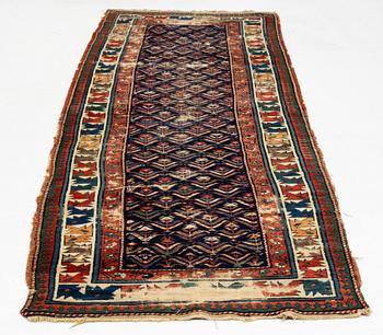 A antique Kazak gallery carpet, ca 310 x 105 cm.