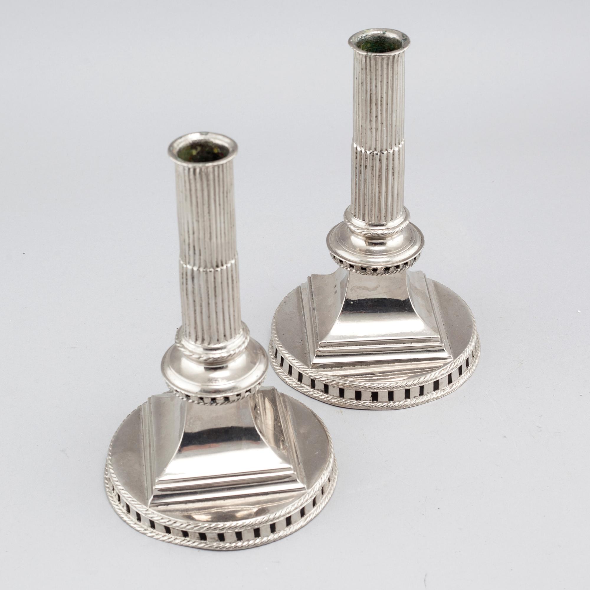 A pair of candlesticks in silver-plated pewter, by Gottlob Friedrich Baumann in Hudiksvall, 1794 and 1799.