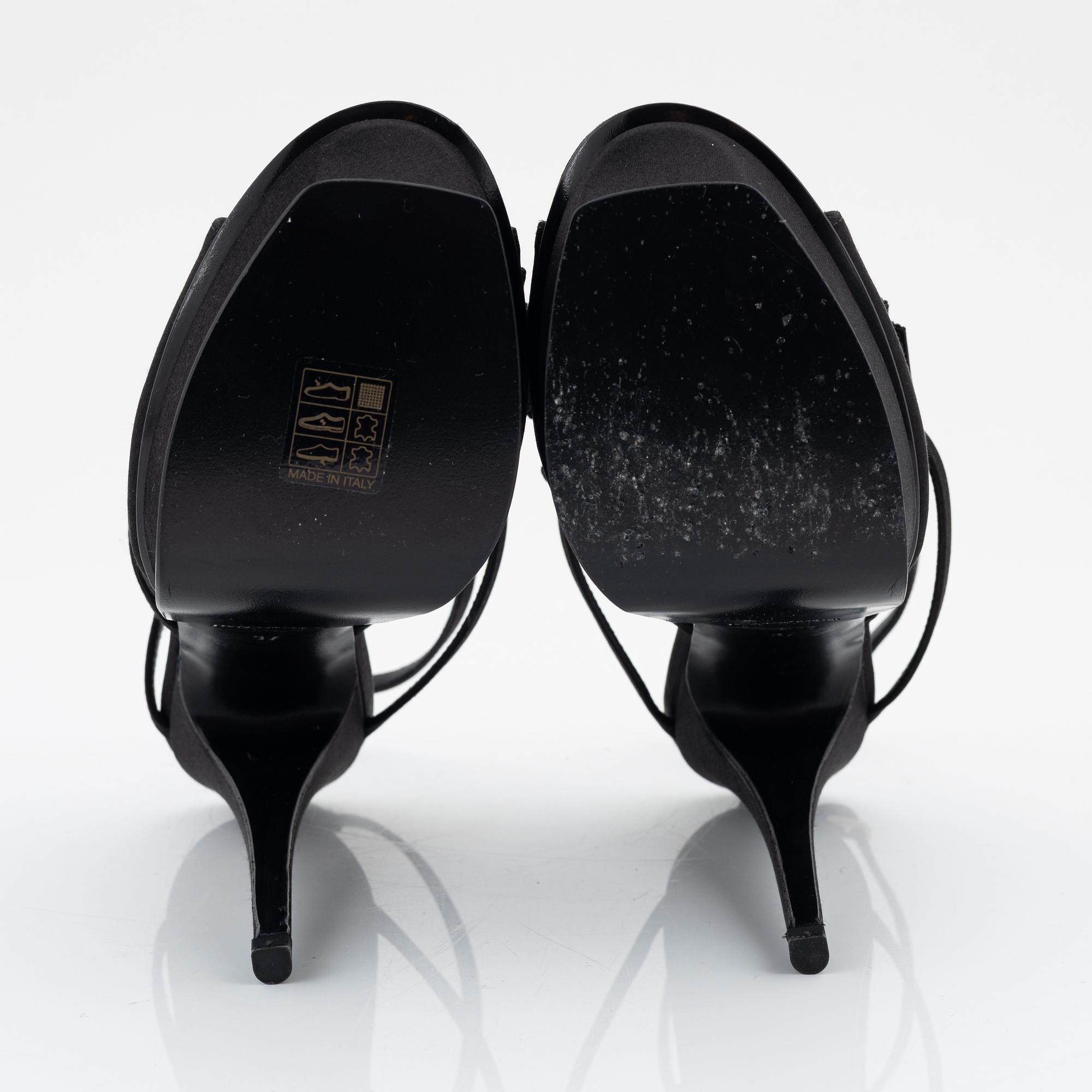 Yves Saint Laurent, a pair of black silk and bows platform sandals, size 37.