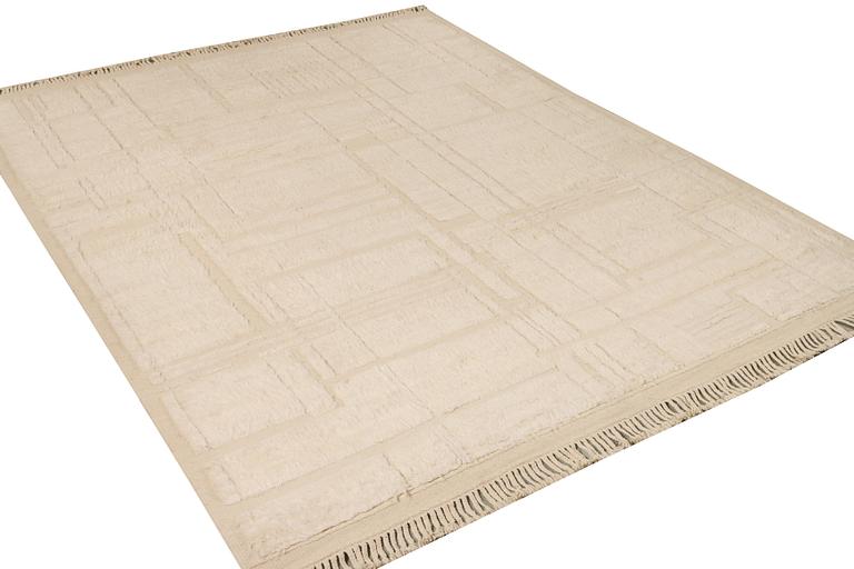 A relief-cut Moroccan carpet, c. 321 x 251 cm.