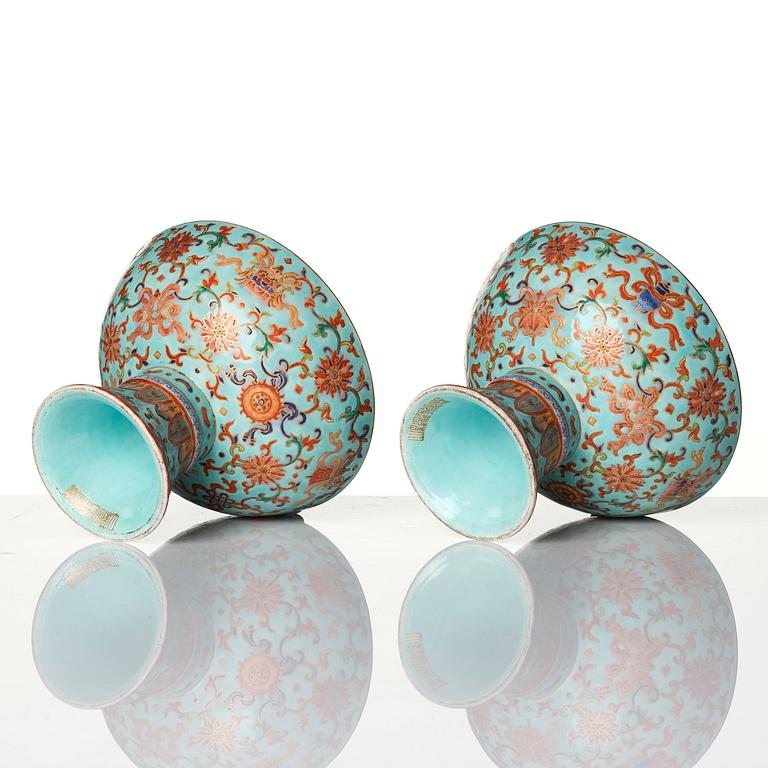 A pair of rare turquoise ground 'baijiaxiang' stemcups, Qing dynasty with Daoguang mark and period (1821-1850).