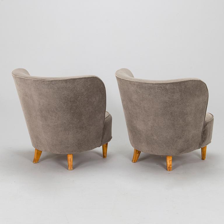 A pair of mid 20th century armchairs.