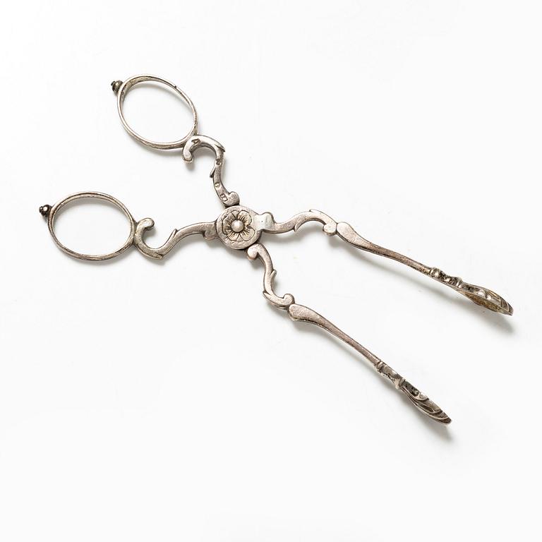A pair of Swedish silver sugar tongs, mark of Isak Sauter, Stockholm, 1759. Rococo.