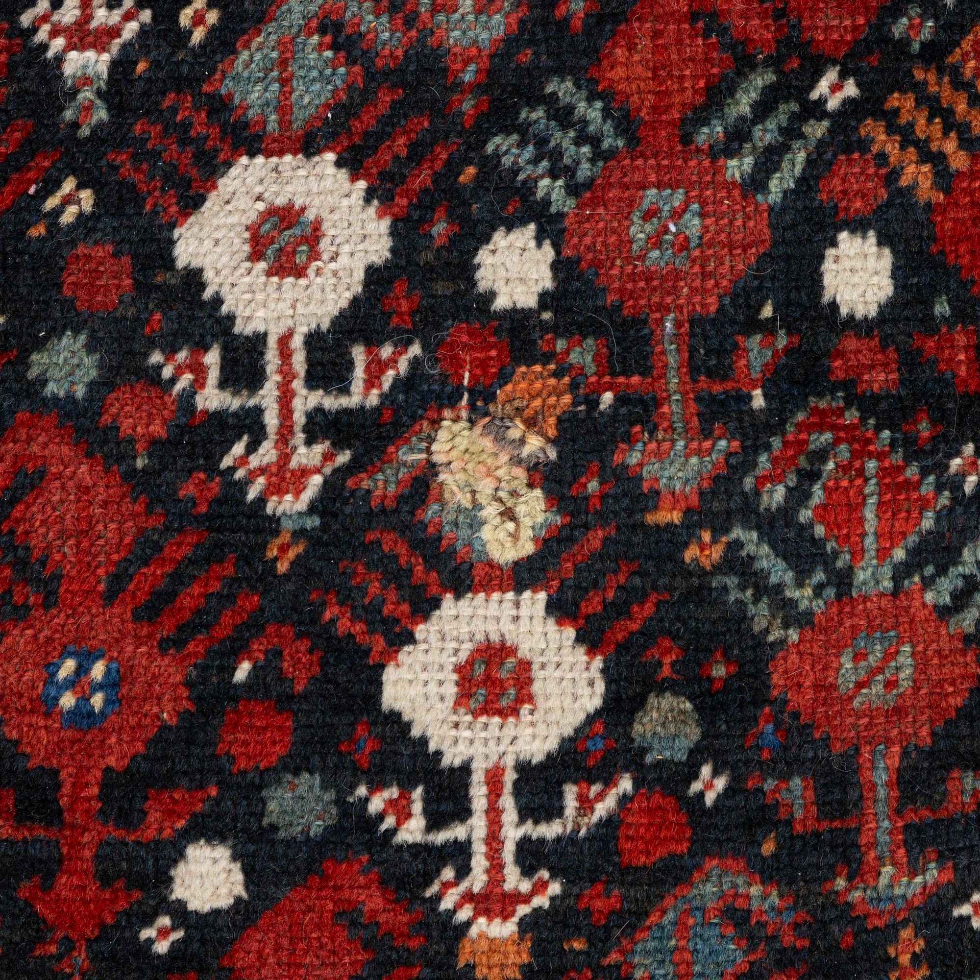 An antique Qashgai rug, 230 x 135 cm.