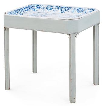 A Swedish Rörstrand faience tea table dated 1745.