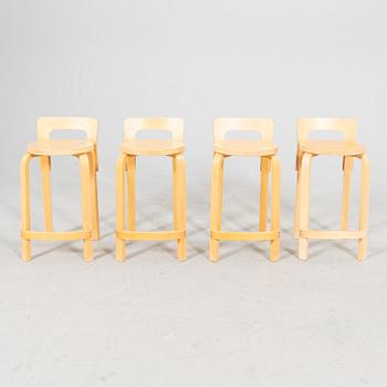 A set of four birch bar stools by Alvar Aalto, modell "K65" Artek, from the second half of 20th century.