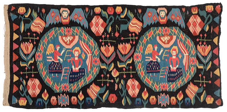 Åkdyna, "Bebådelsen", flamskväv, ca 105 x 52 cm, Skåne, 1800-1830.