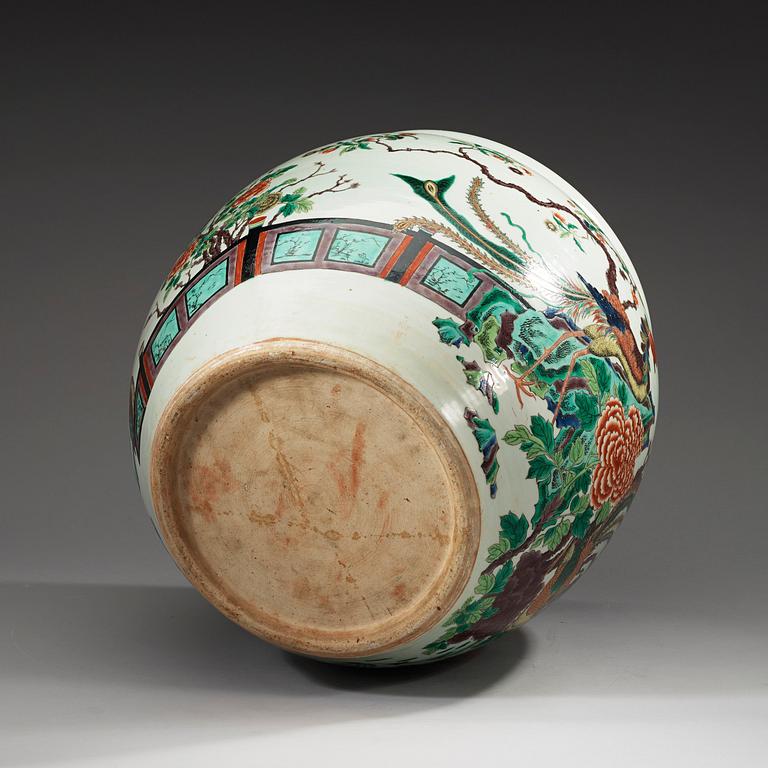 A famille rose jardiniere, decorated with a terrace scene with blossom and birds, late Qing dynasty, about 1900.