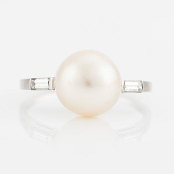 Platinum ring with pearl and baguette-cut diamonds.