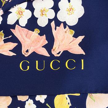 Gucci, a silk scarf.