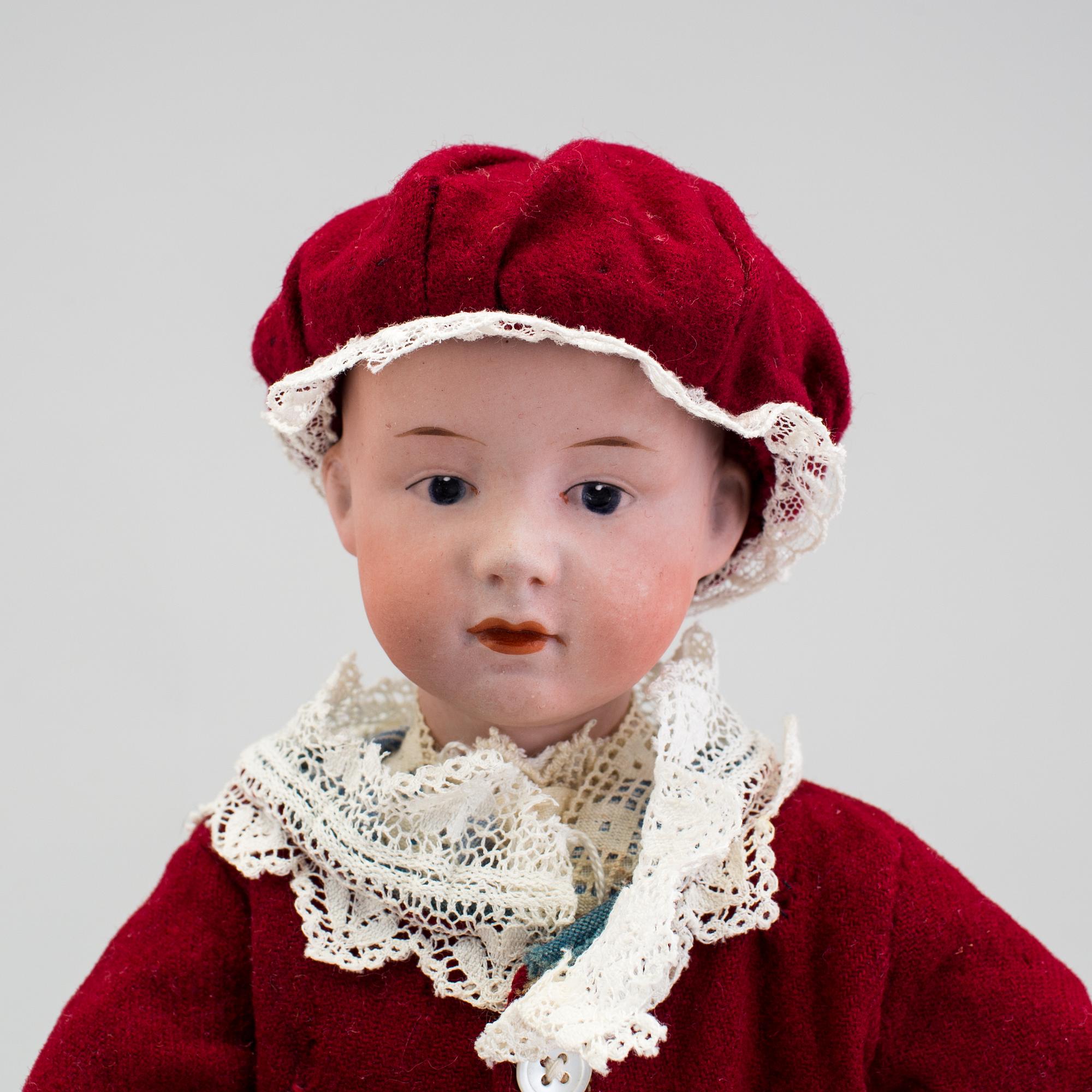A bisque headed character boy doll, Germany, 1910s.