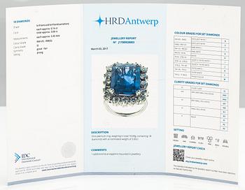 A platinum ring with a ca. 18.00 ct sapphire and ca. 3.00 cts of diamonds. With certificates.
