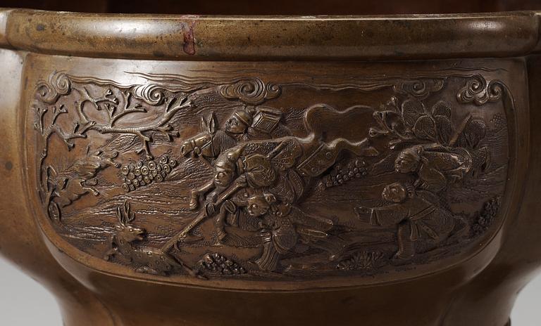 A pair of lobed bronze flower pots, Qing dynasty, with Xuandes six character mark to the interior.