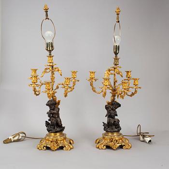 A pair of  mid 19th century, rococo-style TABLE LAMPS/CANDELABRA.