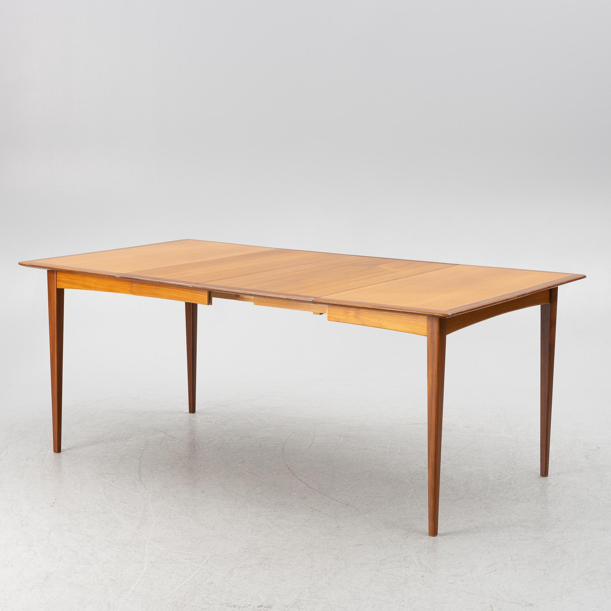 A dining table and four chairs, 1950s-60s.