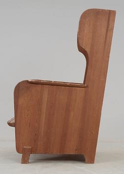 An Axel Einar Hjorth 'Lovö' stained pine armchair, Nordiska Kompaniet, Sweden 1930's.