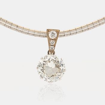 931. A platinum and 14K white gold pendant set with an old-cut diamond weight ca 3.00 cts quality ca K/L vs.