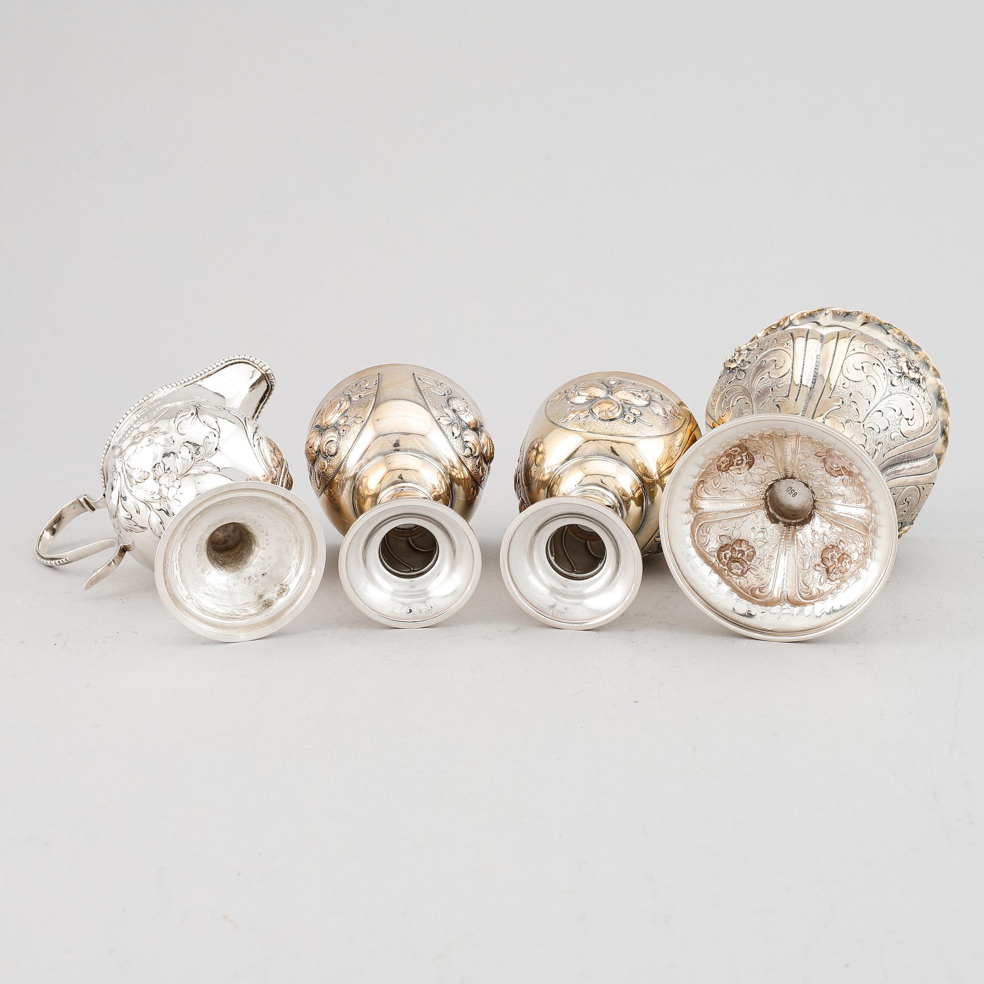 A mixed lot of two beakers, a vase and a jug, Baroque style, silver 830, 20th century.