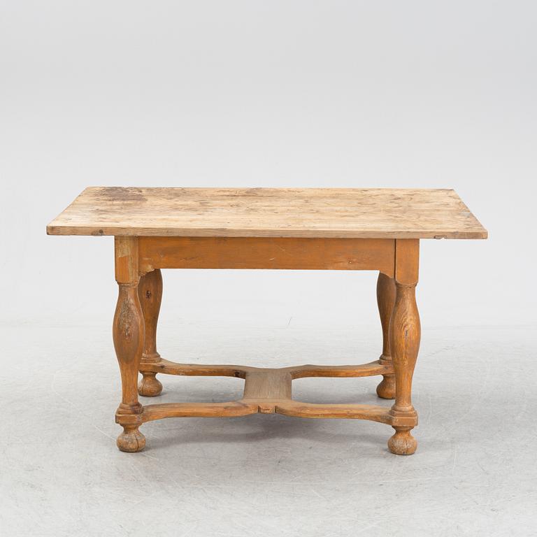 A pine Baroque style dining table, 19th Century.