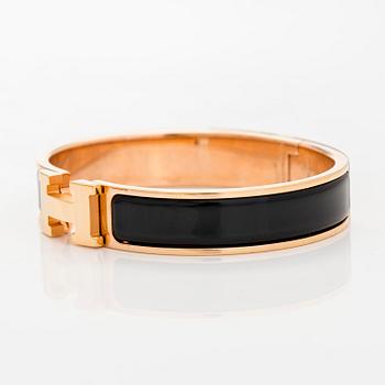 Hermès, a 'Clic H' bracelet.
