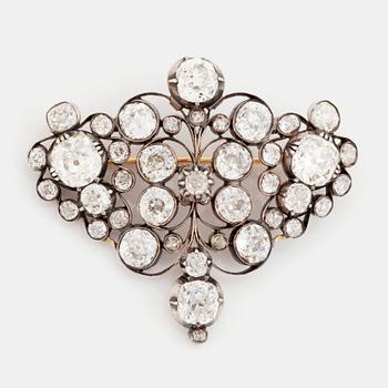 540. A gold and silver brooch set with old-cut diamonds.