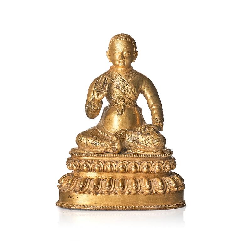 A gilt copper alloy figure of a Lama, most likely Sonam Tsemo, Tibet, probably 16/17th century.