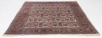 An oriental carpet, approx. 286 x 200 cm.