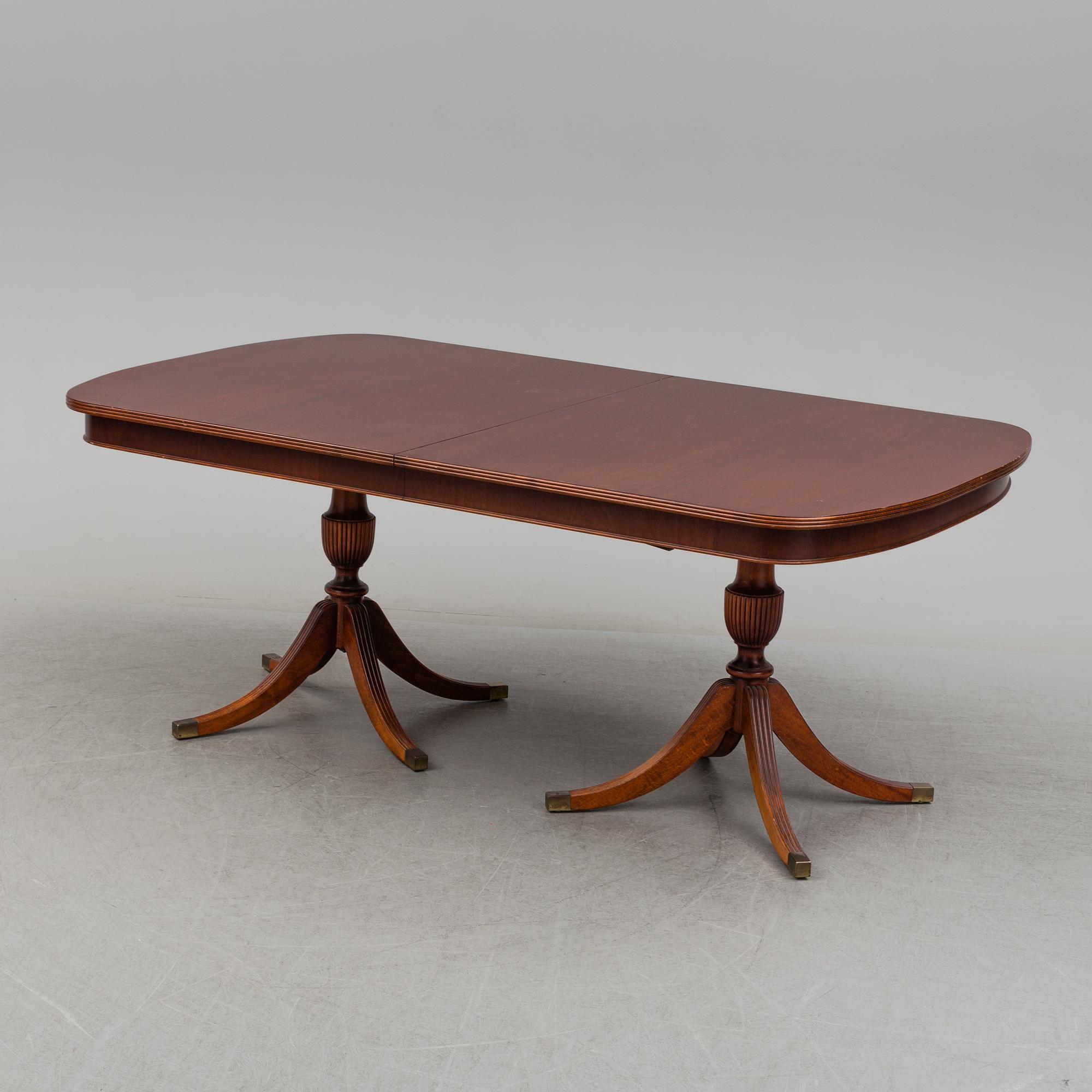 A dining table and 12 chairs, second half of the 20th century.