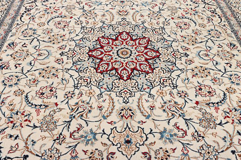 A Nain carpet, part silk, 9 laa, c. 390 x 295 cm.