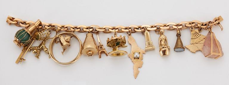 An 18K gold charm bracelet.