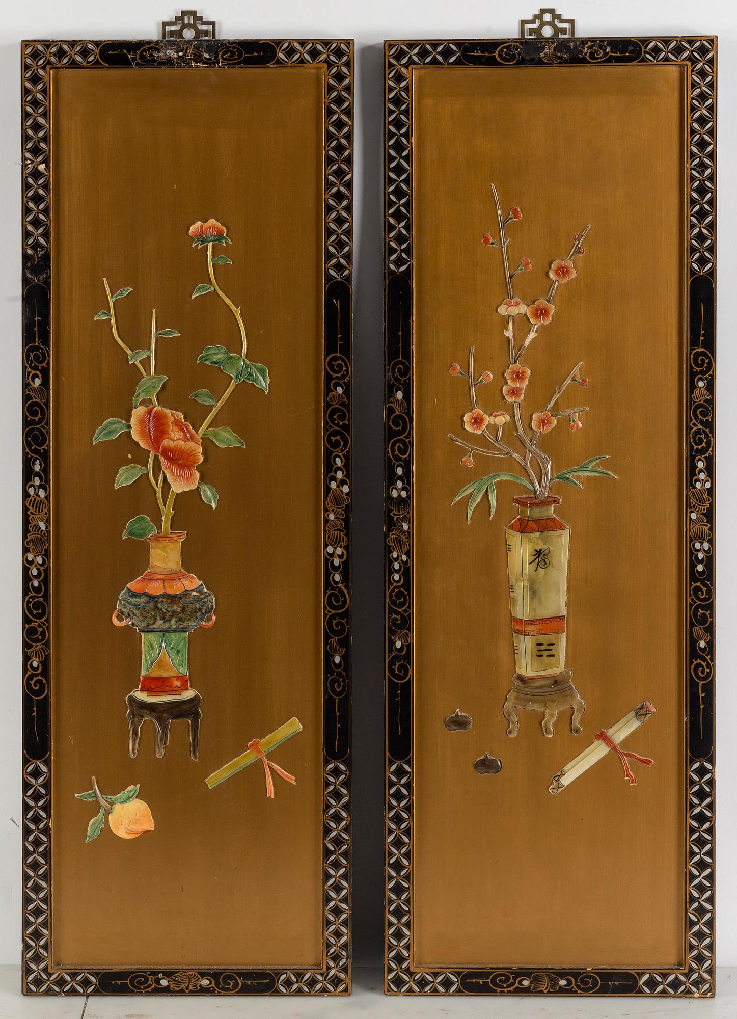 A pair of Chinese wooden panels with stone inlays.