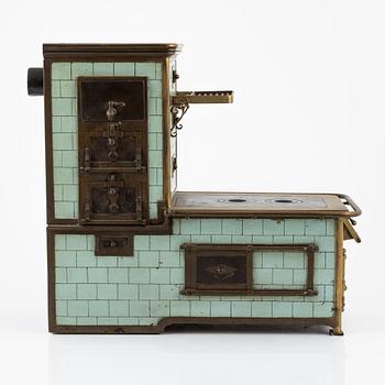 A toy stove, ca early 20th century.