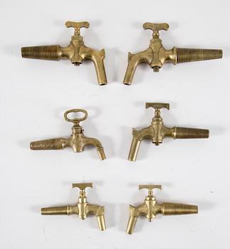 A set of six brass taps, 20th century.