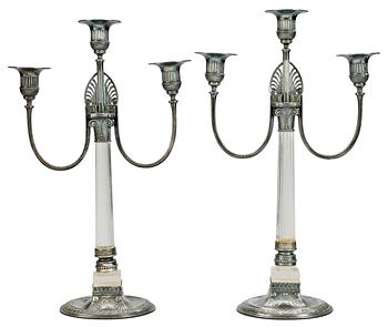 564. A pair of white metal three lights candelabra, Orivit, Germany, early 20th Century.