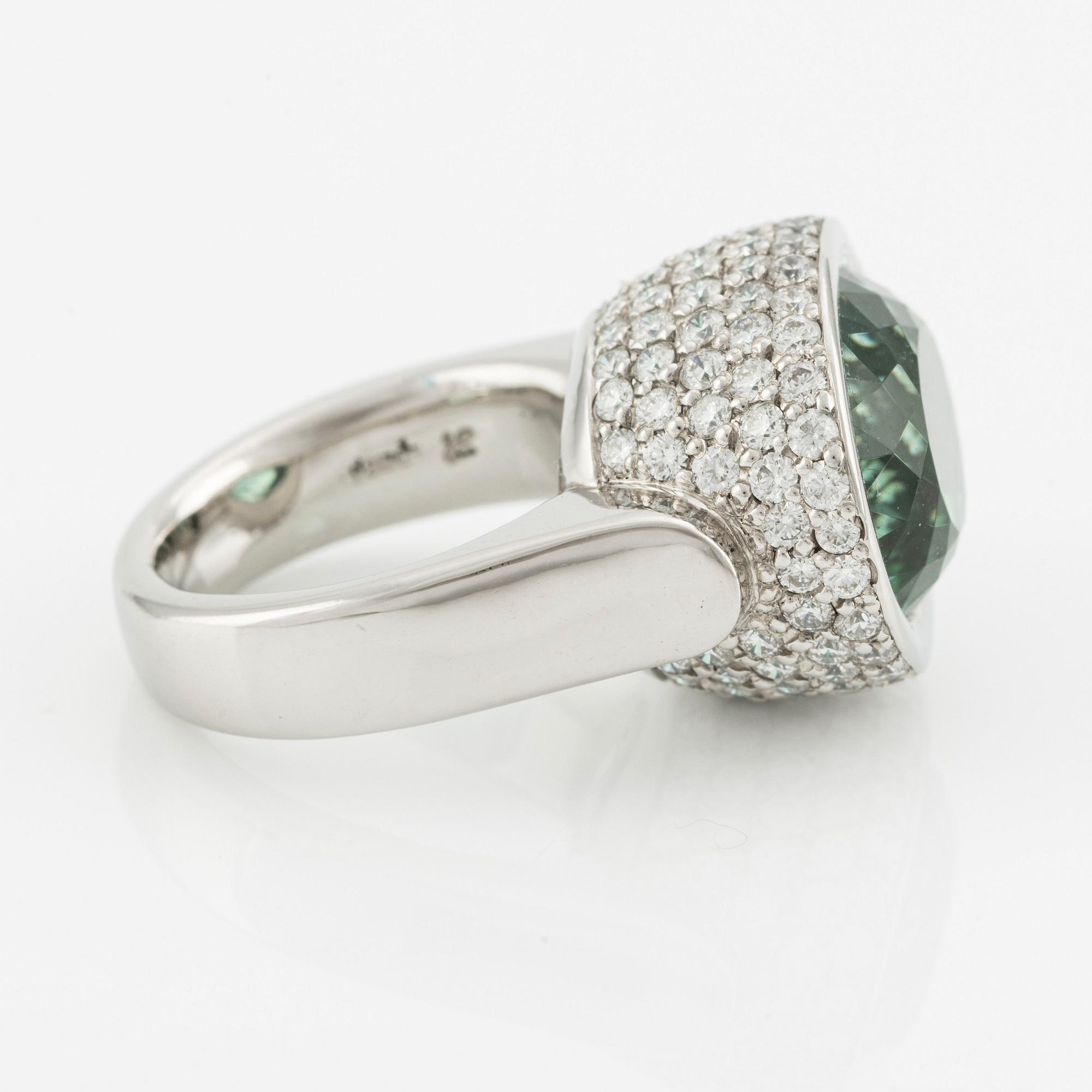 Gaudy ring platina med en fasettslipad turmalin och runda briljantslipad diamanter.