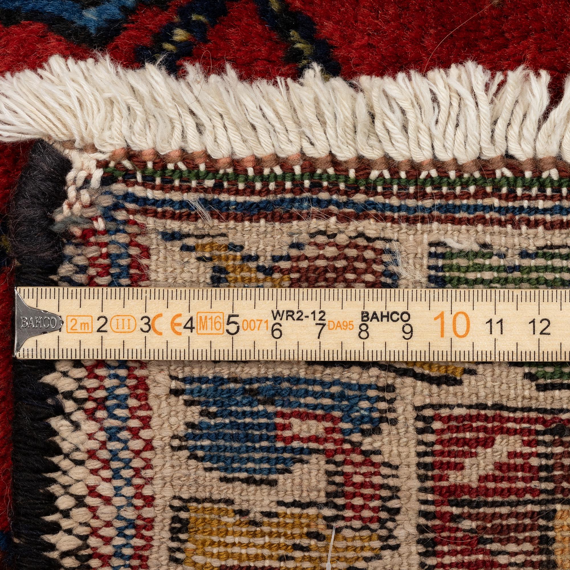 A semi-antique pictoral Mazlagan rug, Northwest Iran, c. 195 x 125 cm.