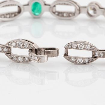 An 18K white gold bracelet set with faceted emeralds.