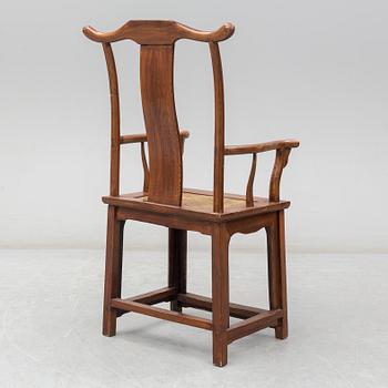 A Chinese wooden armchair, 20th century.
