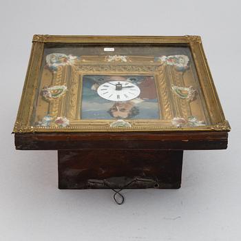 A Schwarzwald area wall pendulum clock with mechanical eye-movment, mid 19thcentury.