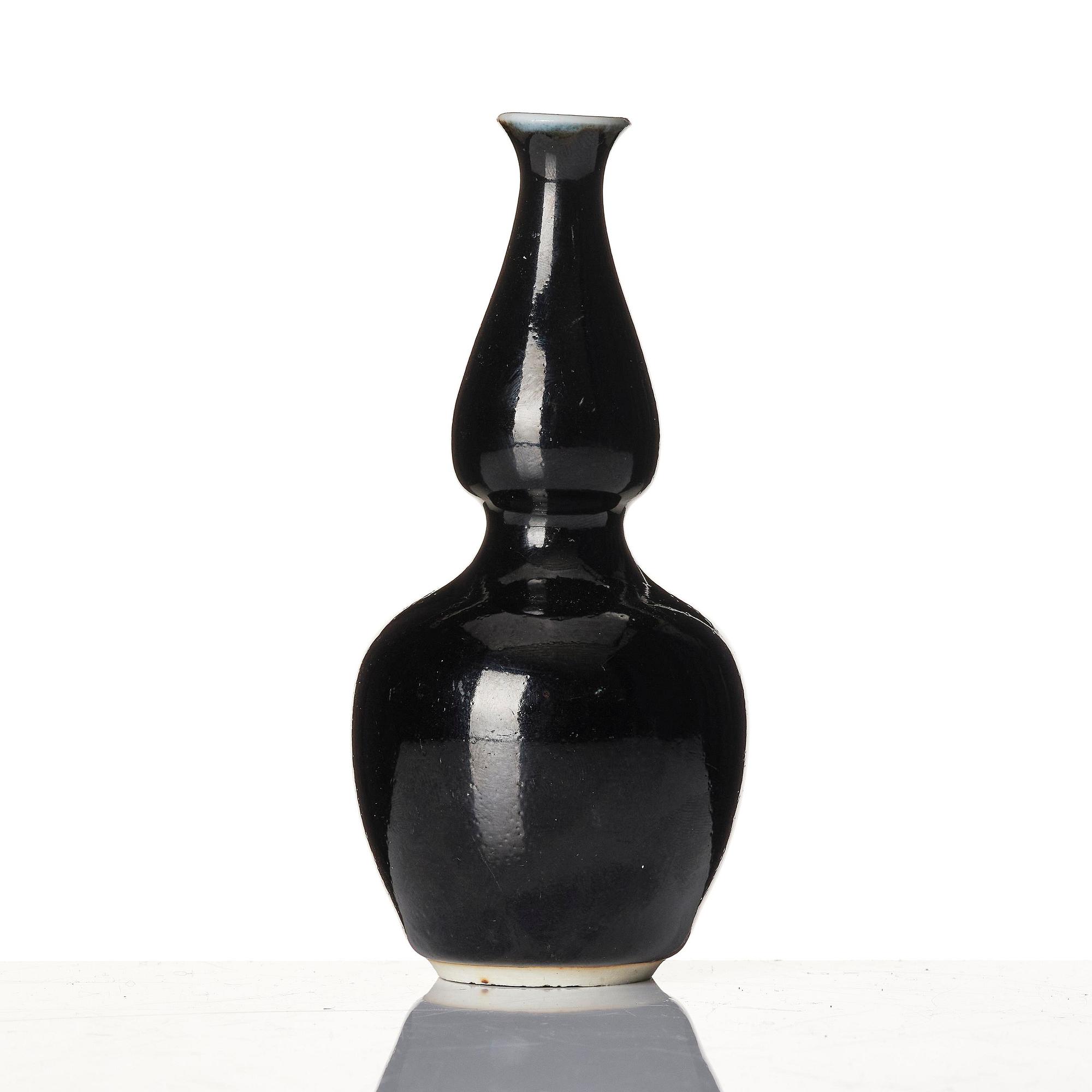 A calebass shaped black glazed vase, Qing dynasty, 19th century.