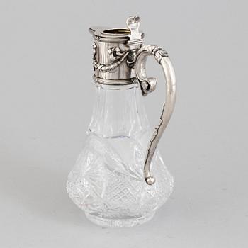 A Russian caraffe with silver mounts marked i cyrillic V Gordon, Early 20th century.