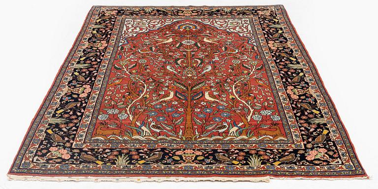An antique 'Manchester' Kashan rug, central Persia, c 222 x 133 cm.