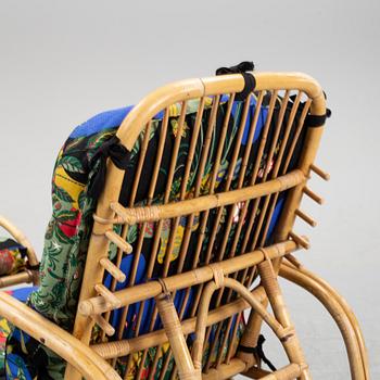 An armchair with ottoman, bamboo and rattan, second half of the 20th century.