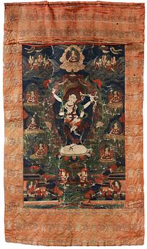 A Beijing Thangka of a four-armed goddess surrounded by Buddhist pantheon, 1920's.